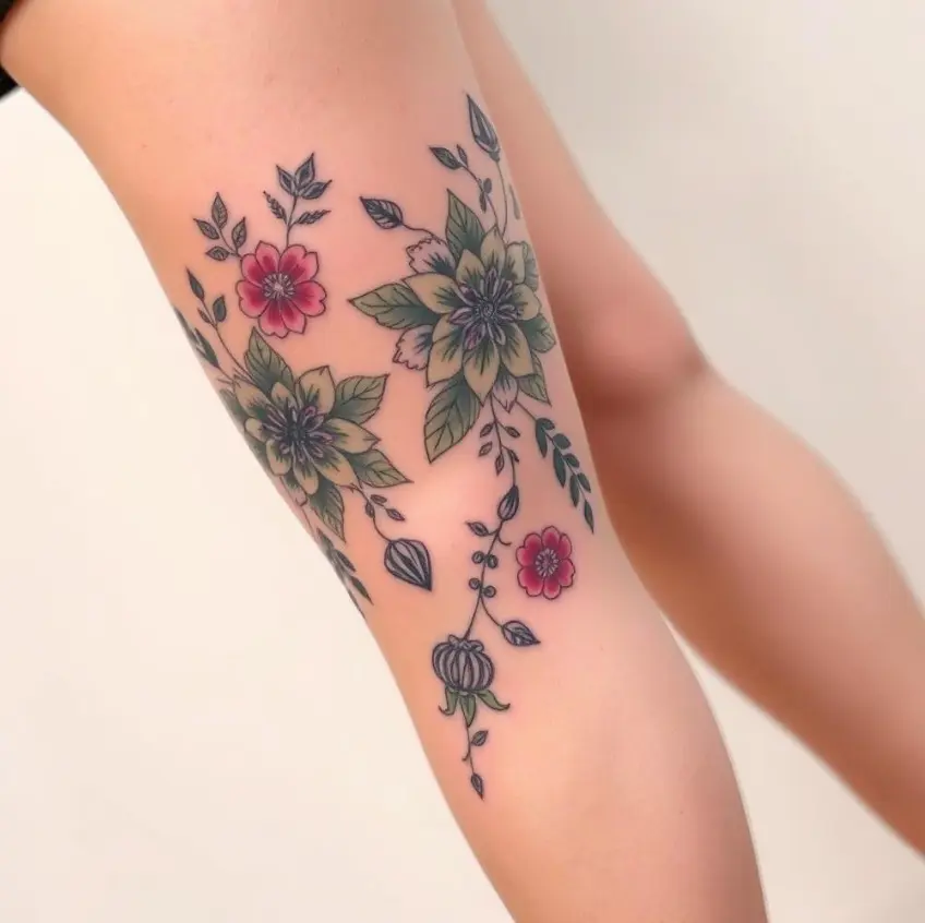 elegant above knee tattoo for women